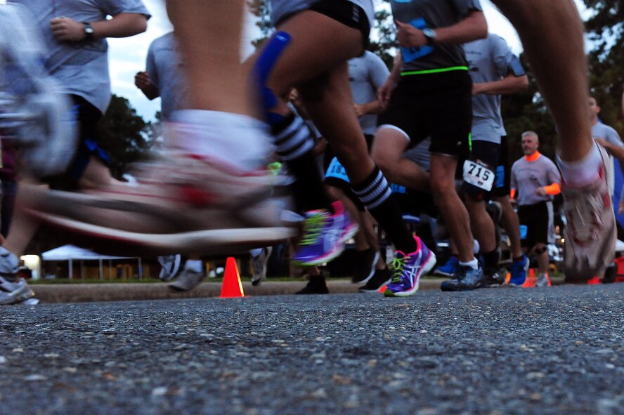 Participants take off during the Run for the Fallen 5K/Half-Marathon, hosted by the 4th Fighter Wing Company Grade Officers’ Council, a private organization made up of Air Force lieutenants and captains, at Seymour Johnson Air Force Base, N.C., Sept. 14, 2013.  The event raised more than $10,000 for the Wounded Warrior Project, which offers a variety of programs to aid injured Service members.  (U.S. Air Force photo by Airman 1st Class Brittain Crolley)