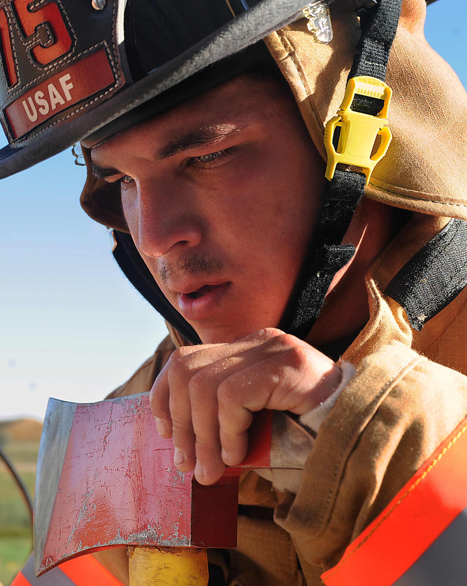 Airman 1st Class Nickolas Torrez, 5th Civil Engineer Squadron firefighter, takes a moment to rest after completing a memorial stair climb at Minot Air Force Base, N.D., Sept. 11, 2013. Torrez was part of a five-man team that climbed 110 flights of stairs at the firefighter training facility as a way of paying tribute to those who lost their lives in the 9-11 terrorist attacks.  (U.S. Air Force photo/Senior Airman Stephanie Sauberan)