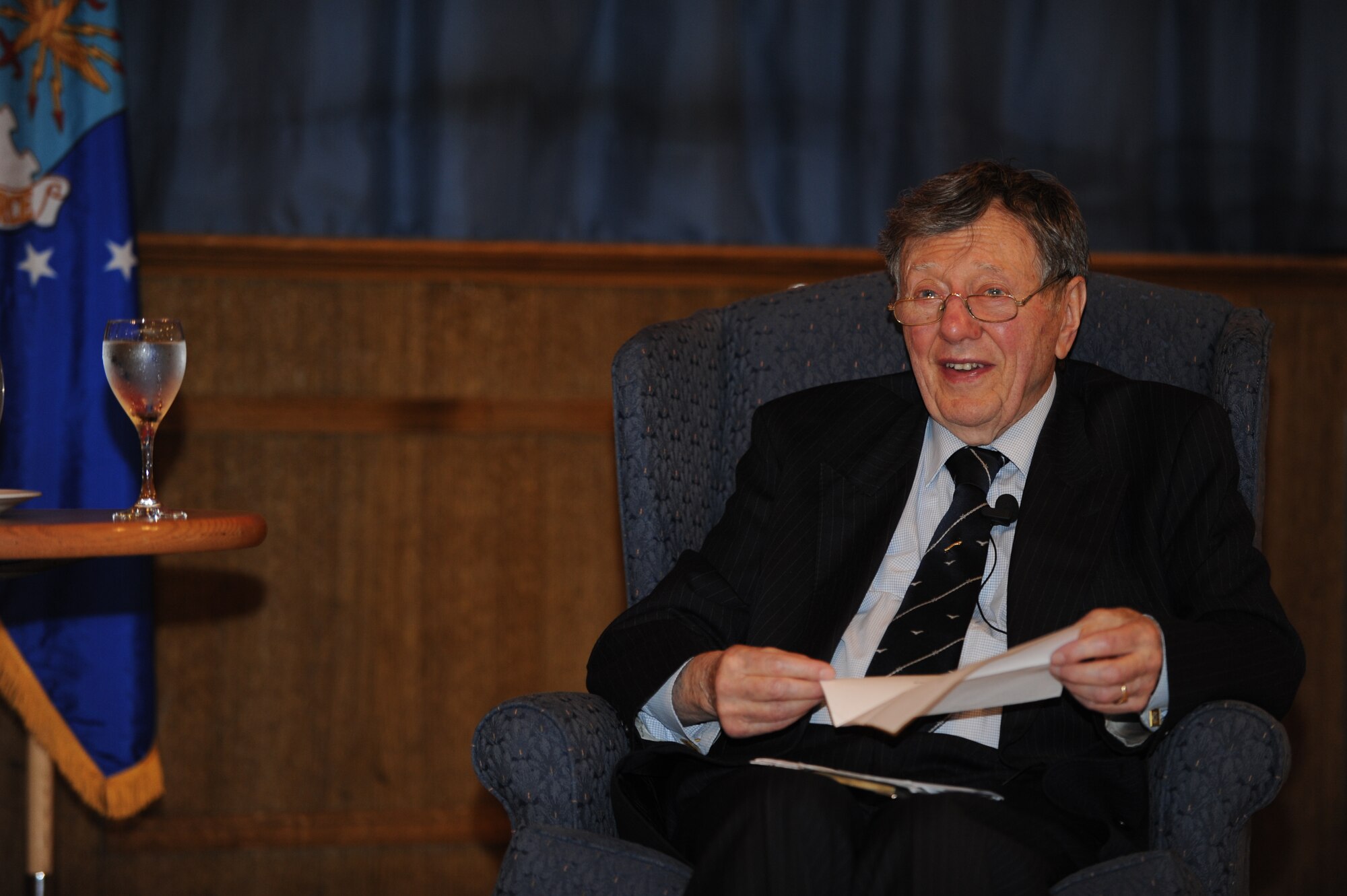 Former prisoner of war retired Royal Air Force Air Cdre. Charles Clarke reads a poem to Team Mildenhall members during the Prisoner-Of-War/Missing-In-Action Remembrance Luncheon Sept. 18, 2013, in the Galaxy Club on RAF Mildenhall, England. Clarke read “Three Cheers for the Men on the Ground” in recognition of the support from ground crews he received during World War II. (U.S. Air Force photo by Airman 1st Class Preston Webb/Released)