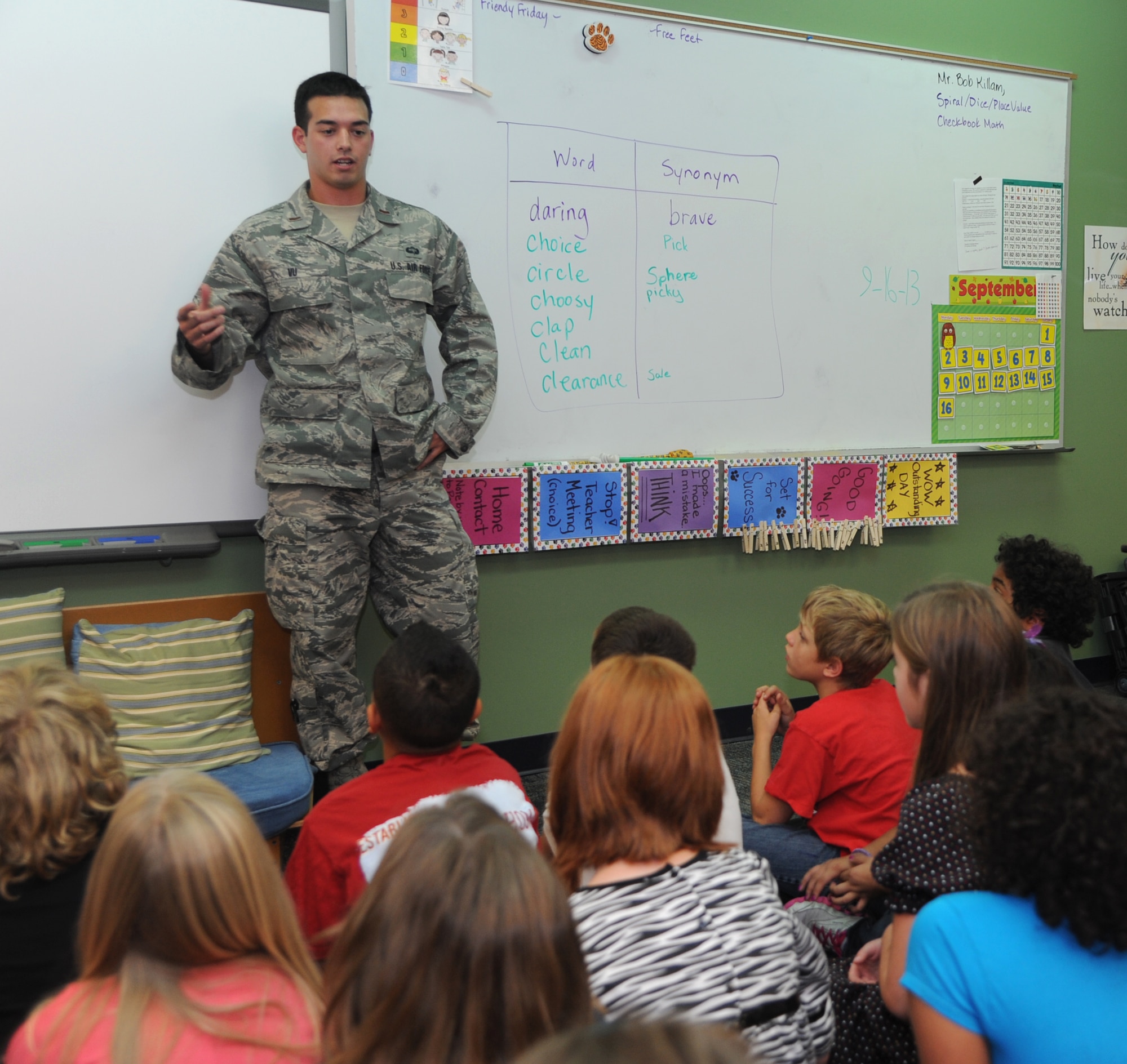 Second Lt. Stephen Vu, with the 71st Student Squadron, at Vance Air Force Base, Okla., explains the ins and outs of the Airmen Boosting Learning in Enid program to students at Taft Elementary School in Enid. The ABLE program provides Airmen opportunities to get involved with the local community. (U.S. Air Force photo/ Senior Airman Frank Casciotta).