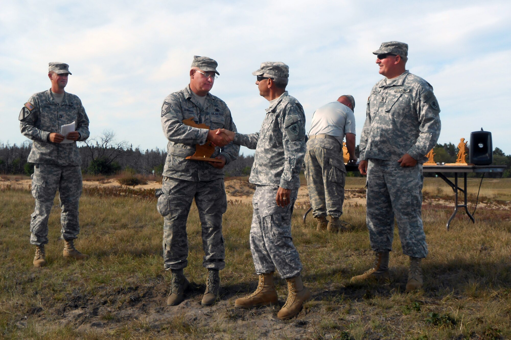 130908-Z-ZZ999-001 -- SMSgt. Michael Suwinski receives a trophy from Major Gen. Gregory Vadnais, adjutant general of Michigan, for his performance at the Governor’s 20 Marksmanship competition, Sept. 8, 2013, at Camp Grayling, Mich. Suwinski and TSgt. Doug Shippy, both members of the 127th Wing from Selfridge Air National Guard Base, Mich., each were winners of individual matches at the event, which features the top marksmen from the Michigan Army and Air National Guard. (U.S. Air National Guard photo by SMSgt. Craig Shepard/Released)
