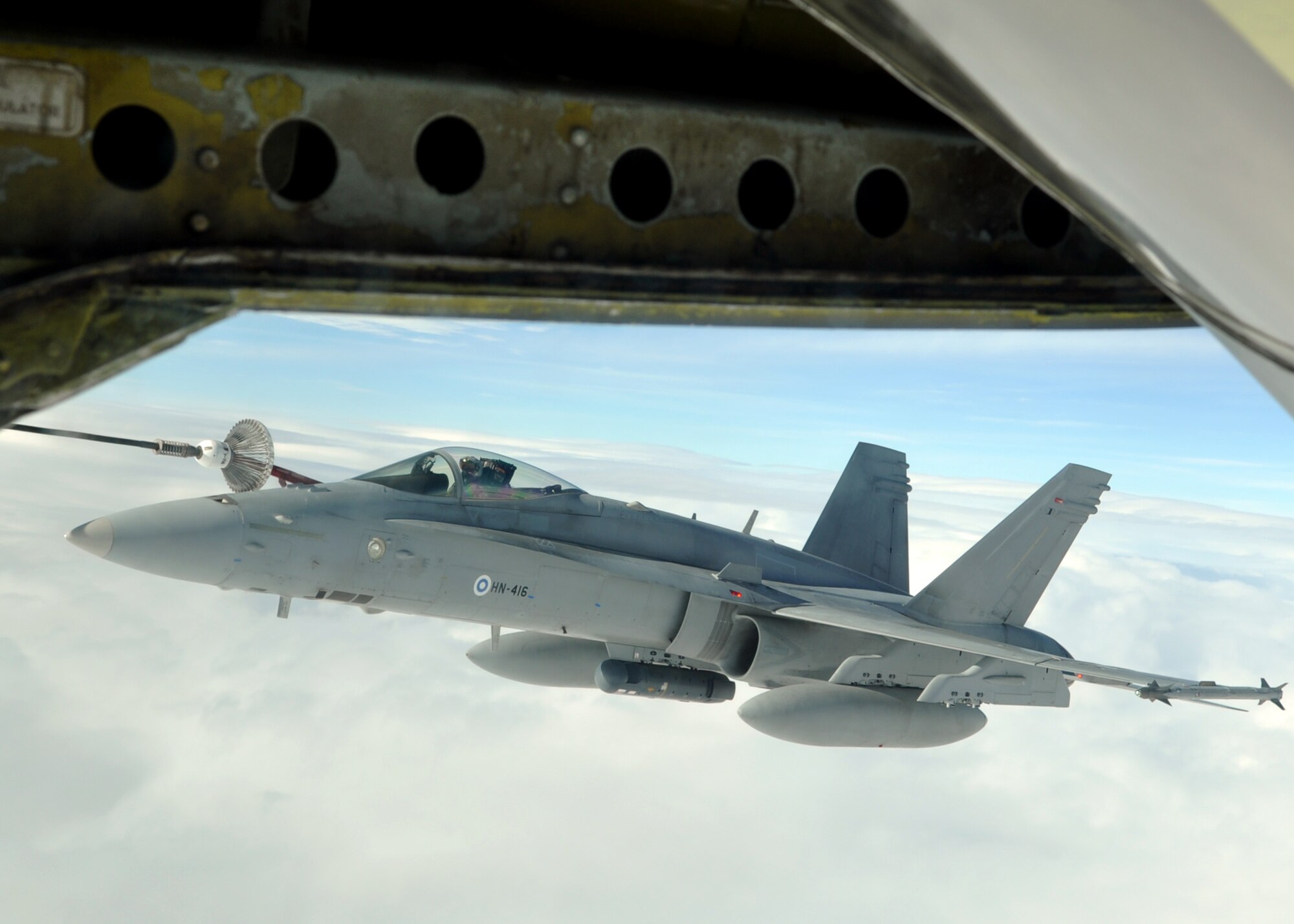 A Finnish Air Force F-18C Hornet receives fuel from a U.S. Air Force KC-135R Stratotanker Sept. 17, 2013, during the Arctic Challenge exercise. The Hornet refueled using the multi-point refueling system on the Stratotanker, highlighting the wide variety of aircraft the U.S. Air Forces in Europe support. (U.S. Air Force photo by 1st Lt. Christopher Mesnard/Released)