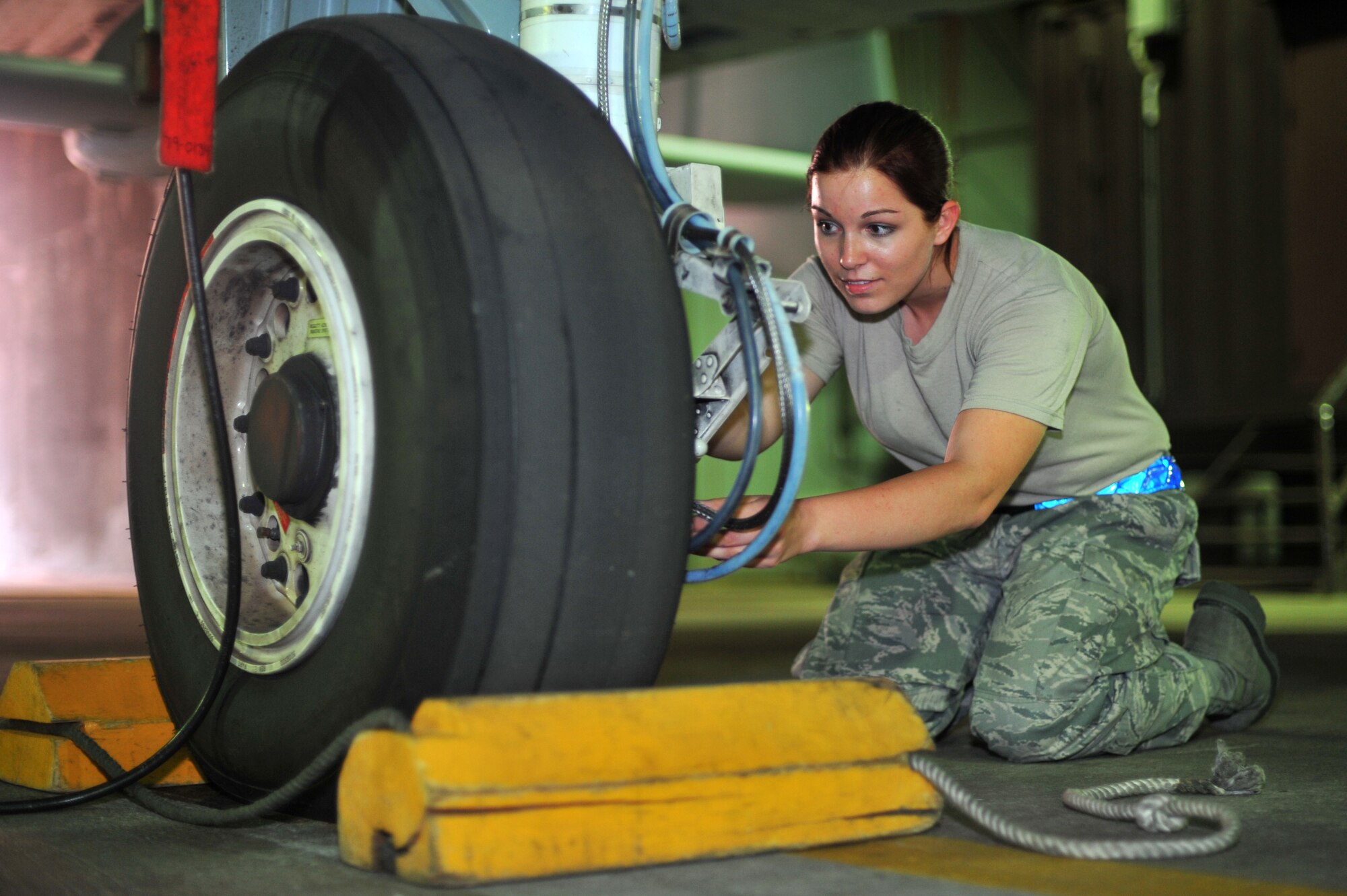 Airman 1st Class Shelbee Butterfield, 51st Maintenance Squadron crew chief, checks an A-10 Thunderbolt’s brake pads at Osan Air Base, Republic of Korea, Sept. 18, 2013. Butterfield is this week’s Airman Spotlight winner. (U.S. Air Force photo/Staff Sgt. Emerson Nuñez)