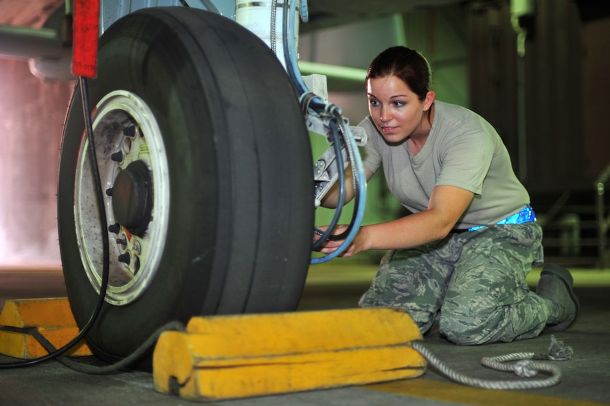 Airman 1st Class Shelbee Butterfield, 51st Maintenance Squadron crew chief, checks an A-10 Thunderbolt’s brake pads at Osan Air Base, Republic of Korea, Sept. 18, 2013. Butterfield is this week’s Airman Spotlight winner. (U.S. Air Force photo/Staff Sgt. Emerson Nuñez)