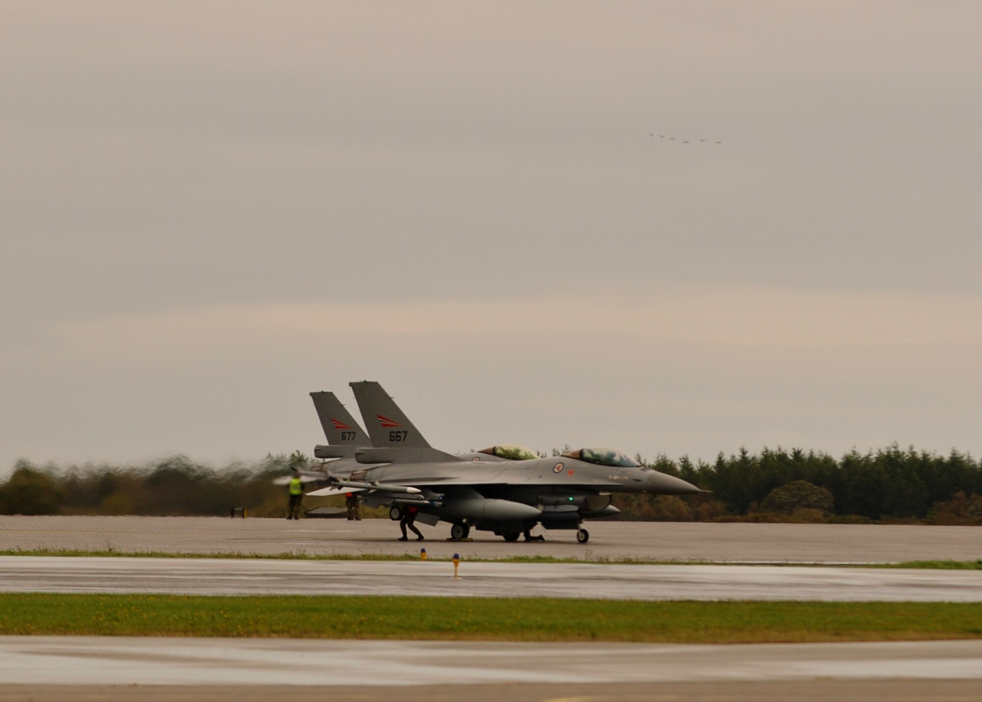 Two Norwegian F-16AM Fighting Falcons conduct an engine run-up prior to take off Sept. 16, 2013, on Ørland Main Air Station, Norway. Norway hosted the Arctic Challenge exercise from Sept. 16 to 26 as a way for countries in the area to practice aerial tactics together without their people and equipment having to travel far away. (U.S. Air Force photo by 1st Lt. Christopher Mesnard/Released)