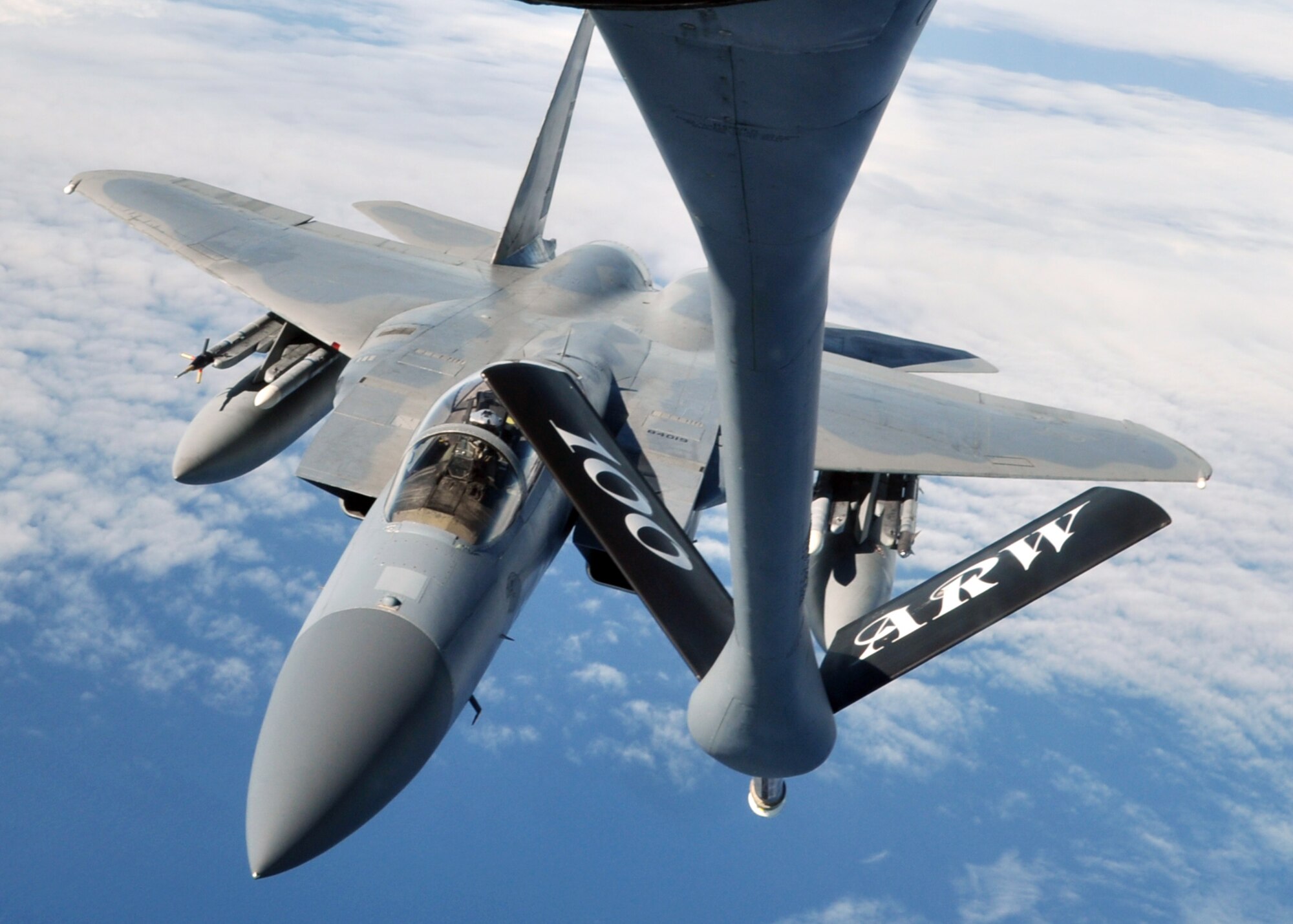 A U.S. Air Force F-15C Eagle finishes refueling with a U.S. Air Force KC-135R Stratotanker Sept. 12, 2013, en route to the Arctic Challenge exercise. The F-15C, in coordination with fighters from Norway, Sweden, Finland and the U.K., provided the air-to-air attack element in many of the scenarios during the exercise. (U.S. Air Force photo by 1st Lt. Christopher Mesnard/Released)