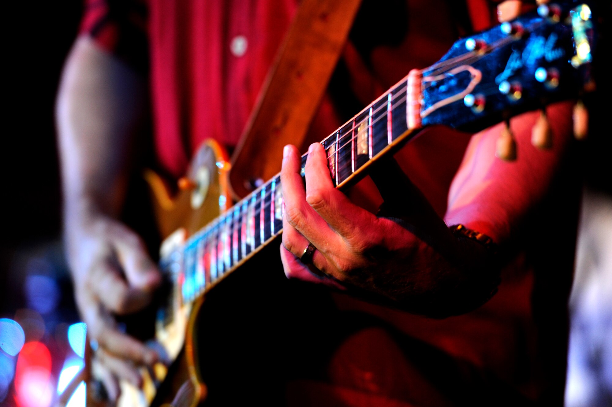 David Ralston from the David Ralston Band sings and plays guitar during the 2013 Air Force Ball on Kadena Air Base, Japan, Sept. 14, 2013. The 2013 Air Force Ball, which was themed "Shaping Airpower with Innovation," signified the 66th Anniversary of the U.S. Air Force. (U.S. Air Force photo by Senior Airman Maeson L. Elleman)