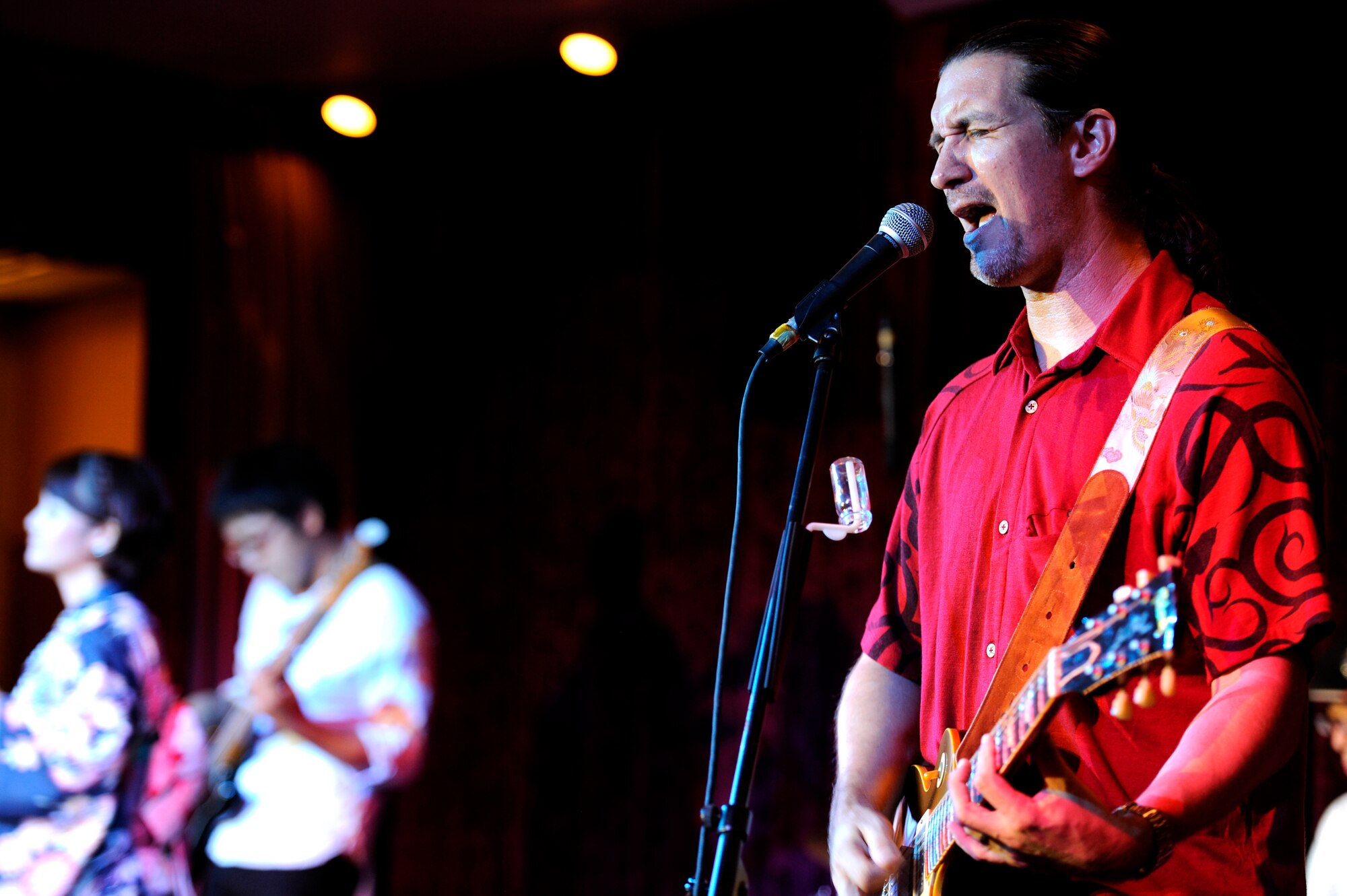 David Ralston from the David Ralston Band sings and plays guitar during the 2013 Air Force Ball on Kadena Air Base, Japan, Sept. 14, 2013. The 2013 Air Force Ball, which was themed "Shaping Airpower with Innovation," signified the 66th Anniversary of the U.S. Air Force. (U.S. Air Force photo by Senior Airman Maeson L. Elleman)