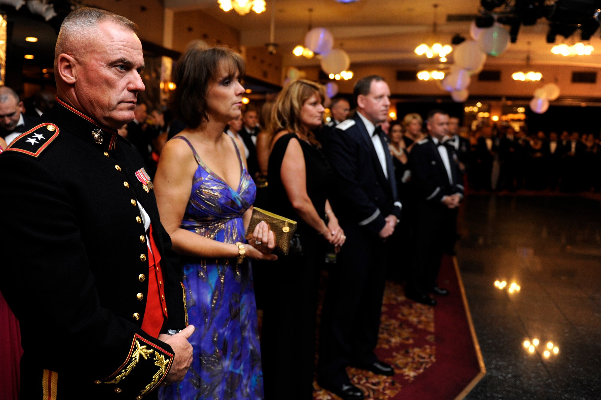 U.S. Marine Corps Maj. Gen. Stacy Clardy III, 3rd Marine Division commanding general, U.S. Air Force Brig. Gen. James Hecker, 18th Wing commander, and their wives listen to a speech about the Air Force history during the 2013 Air Force Ball on Kadena Air Base, Japan, Sept. 14, 2013. Distinguished visitors from the U.S. Marine Corps and Navy, Japan Air Self-Defense Force and Ministry of Foreign Affairs Okinawa Liaison Office Ambassador Extraordinary and Plenipotentiary Toshihisa Takata attended the event. (U.S. Air Force photo by Senior Airman Maeson L. Elleman)