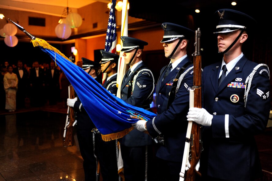 U.S. Air Force Airmen from the Kadena Honor Guard, present the colors during the U.S. and Japanese national anthems preceding the 2013 Air Force ball on Kadena Air Base, Japan, Sept. 14, 2013. This year's theme, "Shaping Airpower with Innovation," honored the people and events that shaped the Air Force through creativity. (U.S. Air Force photo by Senior Airman Maeson L. Elleman)