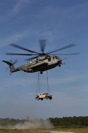 A CH-53 helicopter with Marine Heavy Helicopter Squadron 464 carries a Humvee during a Helicopter Support Team operation as part of Combat Logistics Regiment 25, 2nd Marine Logistics Group’s regimental field exercise aboard Camp Lejeune, N.C., Sept 12, 2013. The exercise gave Marines within the regiment to work together and with supporting units in a simulated deployment environment. (U.S. Marine Corps photo by Lance Cpl. Shawn Valosin)