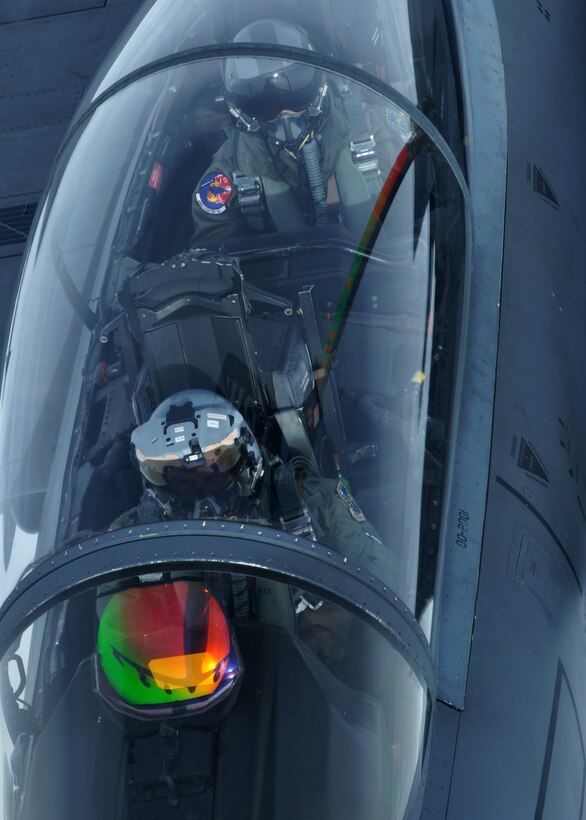 A pilot and a weapons systems operator in a U.S. Air Force F-15E Strike Eagle refuel with a KC-135R Stratotanker Sept. 17, 2013, over Norway during the Arctic Challenge exercise. The exercise afforded pilots from various European nations the chance to fly and practice aerial combat maneuvers with partner nations.