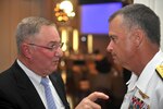 Marine Maj. Gen. Arnold Punaro, retired, chairman of the Reserve Forces Policy Board, talks with Navy Adm. James Winnefeld, vice chairman of the Joint Chiefs of Staff, before the 2013 RFPB dinner in Arlington, Va., Sept. 4, 2013.
