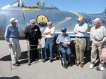 Retired Col. Bill Coburn discusses his time in the Idaho Air National Guard while standing next to an F-86A embossed with his name on it outside the Idaho Military History Museum on Sep. 8. "I have the urge to fly it again, and I would if I could sit in it," he said.