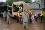 Colorado National Guardsmen respond to floods in Boulder County, Colo., Sept.12, 2013. The Guard is working with local agencies to help people in the area affected by the flooding by evacuating people using high-clearance vehicles.