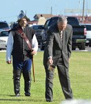 Florida's former adjutant general, retired Maj. Gen. Ronald O. Harrison, is escorted by a historical re-enactor during the First Muster ceremony at the St. Francis Barracks in St. Augustine, Sept. 13, 2013.