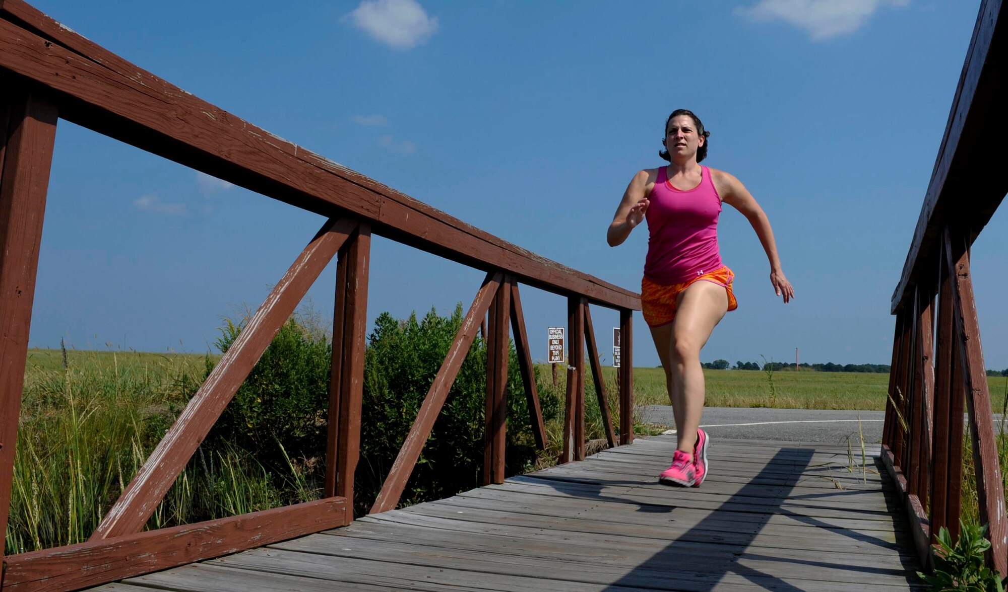 Tech Sgt. Ashley Barnett runs on a trail at Langley Air Force Base, Va., Sept. 10, 2013. Since recovering from a traumatic accident, Barnett successfully finished her bachelor’s degree and recently resumed running. Barnett is a 1st Operations Support Squadron weather mission services NCO in charge.