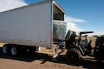 Army Staff Sgt. Lynda Santiago, a supply sergeant with the Colorado Army National Guard's Headquarters and Headquarters Company, 147th Brigade Support Battalion, uses a forklift to offload pallets of water as part of relief and recovery operations near Fort Collins, Colo., Wednesday, Sept. 18, 2013. More than 750 guard members have been working with local, state and federal authorities in response to flooding in central Colorado as a result of heavy rains in the area. Colorado Guard members have evacuated about 700 people by ground and military aerial evacuations currently total 2,394.