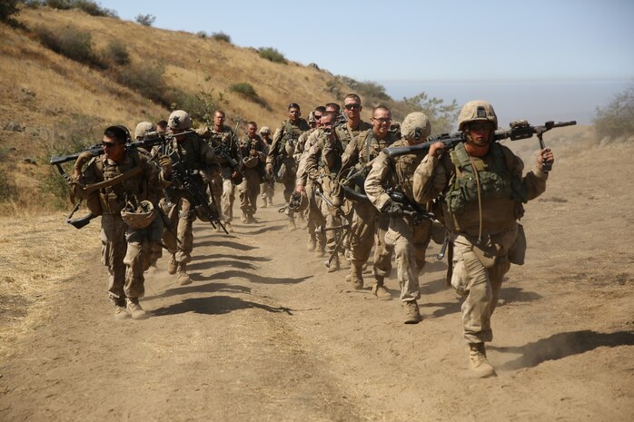 Marines with Fox Company, 2nd Battalion, 5th Marine Regiment, complete a combat readiness exercise on Range 800 here, Sept. 12, 2013. The training helped the battalion see how multiple elements of an attack work together to accomplish a single mission. The training exercise prepared the Marines for future operations as well as combat.