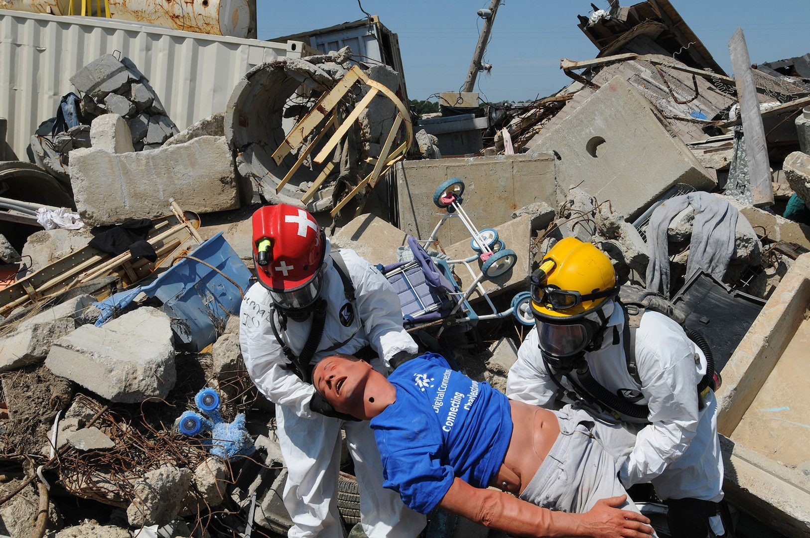 Search and extraction team members pull a "victim" from the rubble July 27, 2012 during Vibrant Response 13, a major incident exercise conducted by U.S. Northern Command and led by U.S. Army North. The team of Ohio National Guard members, are part of the Chemical, Biological, Radiological and Nuclear Enhanced Response Force Package, Homeland Response Force Region V.