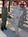 Missouri National Guard Brig. Gen. Randy Alewel, commander of the Missouri National Guard's 35th Engineer Brigade, center, greets Chilean Army Maj. Gen. Mario Puig, left, at the brigade armory at Fort Leonard Wood, Missouri. Puig, the commander of engineers of the Chilean Army, and his staff were on post for a week to learn about U.S. Army Engineer practices and the Missouri Guard's approach to homeland response.