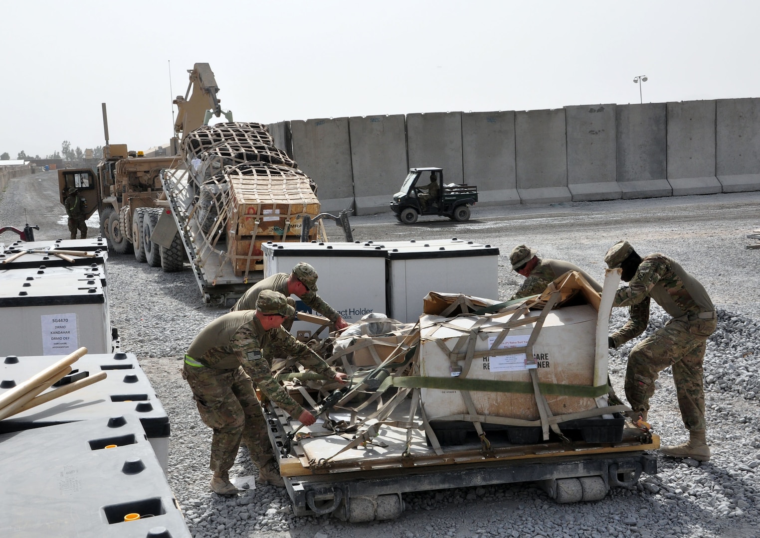 Alabama Army National Guard Soldiers with the 781st Transportation Company strap down cargo, July 24, 2012, at Forward Operating Base Walton, Afghanistan. The 781st TC transports cargo between Kandahar Airfield and other FOB's, helping to sustain troops out in the field.