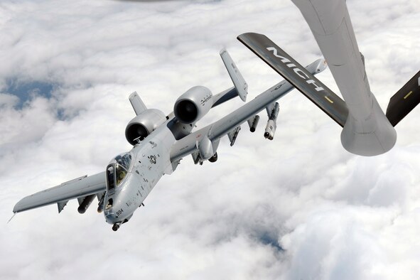 An A-10C Thunderbolt II departs after completing air-to-air refueling from a KC135 Stratotanker while over Michigan, Sept. 13, 2013. Both units are assigned to the Michigan Air National Guard and stationed at Selfridge Air National Guard Base, Mich. The A-10 is assigned to the 107th Fighter Squadron. The KC-135 is assigned to the 171st Air Refueling Squadron. (U.S. Air National Guard photo/Master Sgt. David Kujawa)