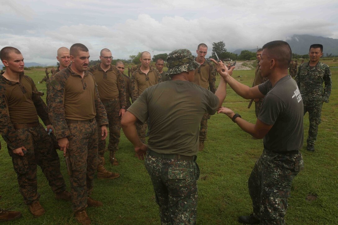 U.S. Marines with 13th Marine Expeditionary Unit learn knife martial arts techniques from Philippine Marines during a Philippine Bilateral Exercise (PHIBLEX) aboard Naval Education Training Center, Philippines Sept. 17, 2013. PHIBLEX is a bilateral training exercise designed to demonstrate the United States and Republic of the Philippines commitment to mutual security and strengthen our long-term partnership, while ensuring the readiness of a bilateral force able to rapidly respond to regional humanitarian crisis. (U.S. Marine Corps photo by Cpl. David Gonzalez, 13th Marine Expeditionary Unit Combat Camera/Unreleased)