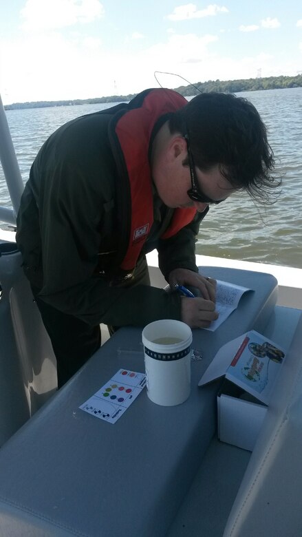 Trey Church, natural resource specialist at Old Hickory Lake, records the four key water quality indicators: dissolved oxygen, pH, temperature, and turbidity from the test site at river mile 237 on the Cumberland River for the 2013 World Water Monitoring Challenge™ Sept. 13, 2013.
