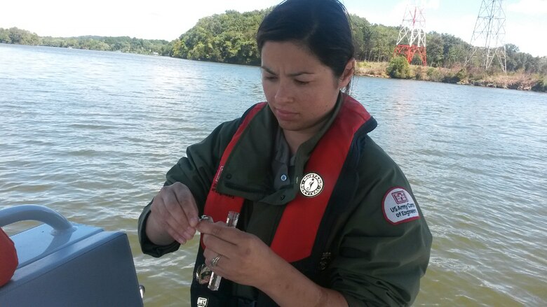 Amy Redmond, natural resource specialist at Old Hickory Lake, prepares the pH sample collected at river mile 247.7 on the Cumberland River for the 2013 World Water Monitoring Challenge™ on Sept. 13, 2013. 