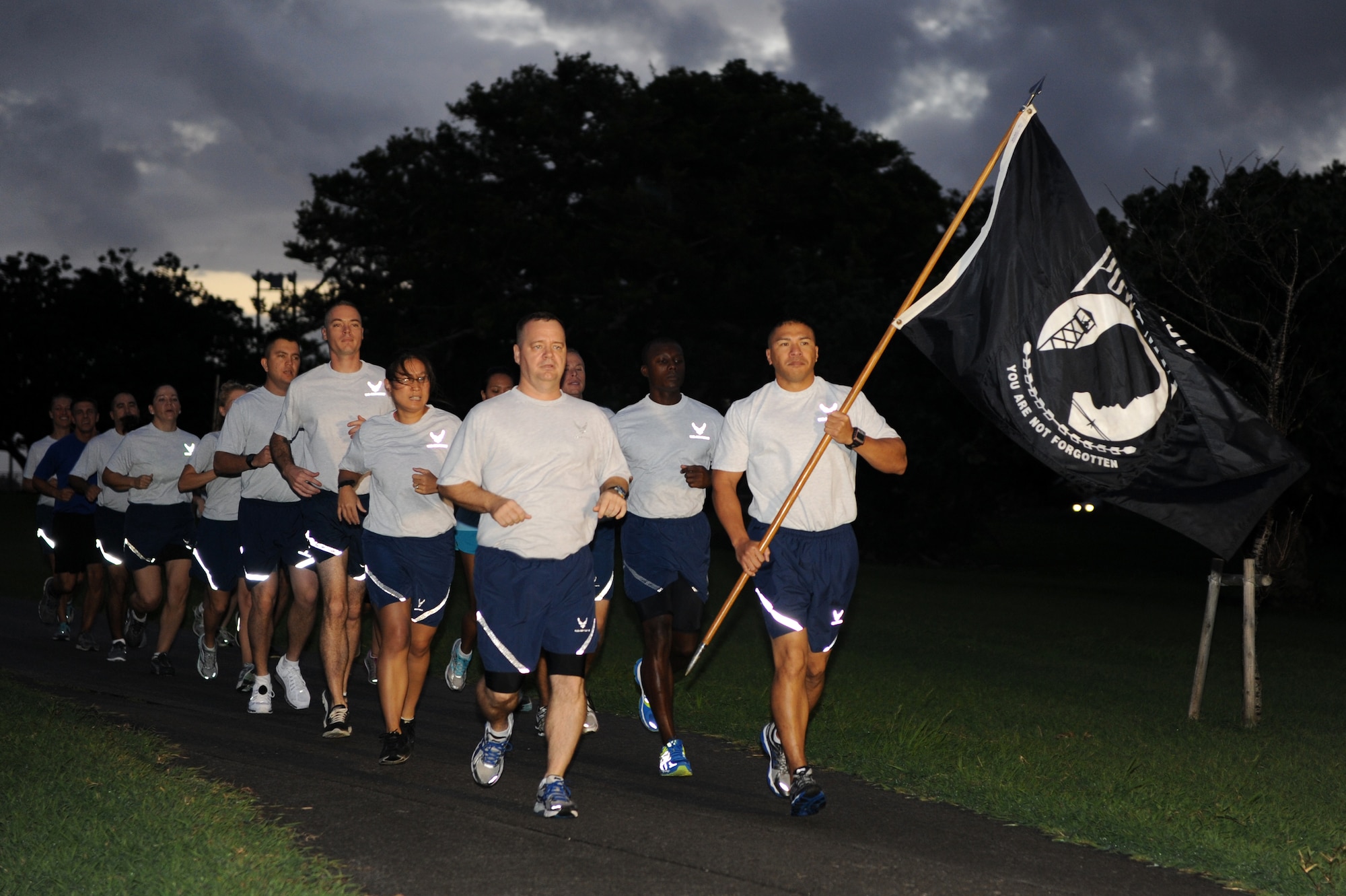 18th Wing Staff Agencies and 18th Mission Support Group personnel kicked off the POW/MIA 24-hour Vigil Run at Marek Park on Kadena Air Base, Japan, Sept. 19, 2013. Various groups and squadrons throughout the 18th Wing signed up for a designated time slot to run during the event in support of more than 70,000 POW and MIA personnel. (U.S. Air Force photo by Airman 1st Class Hailey R. Davis)
