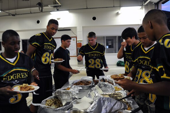 Members of the Edgren High School football team attend a mentorship dinner at the fire station at Misawa Air Base, Japan, Sept. 19, 2013. More than 40 players from the varsity and junior varsity team attended the event, where several firefighters from the 35th Civil Engineer Squadron mentored them on teamwork before their game against American School in Japan. (U.S. Air Force photo by Senior Airman Derek VanHorn)