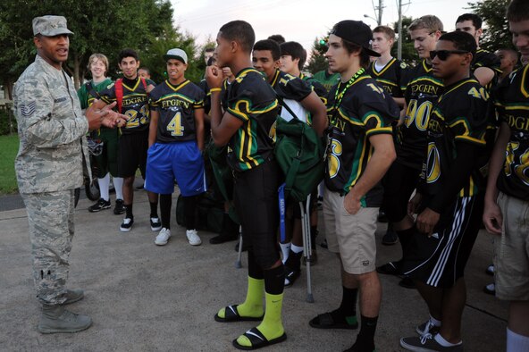 Tech. Sgt. Daniel Robinson, 35th Civil Engineer Squadron assistant fire chief of operations, speaks to members of the Edgren High School football team at Misawa Air Base, Japan, Sept. 19, 2013. Robinson organized the event to provide an opportunity to mentor student-athletes on the importance of teamwork. (U.S. Air Force photo by Senior Airman Derek VanHorn)