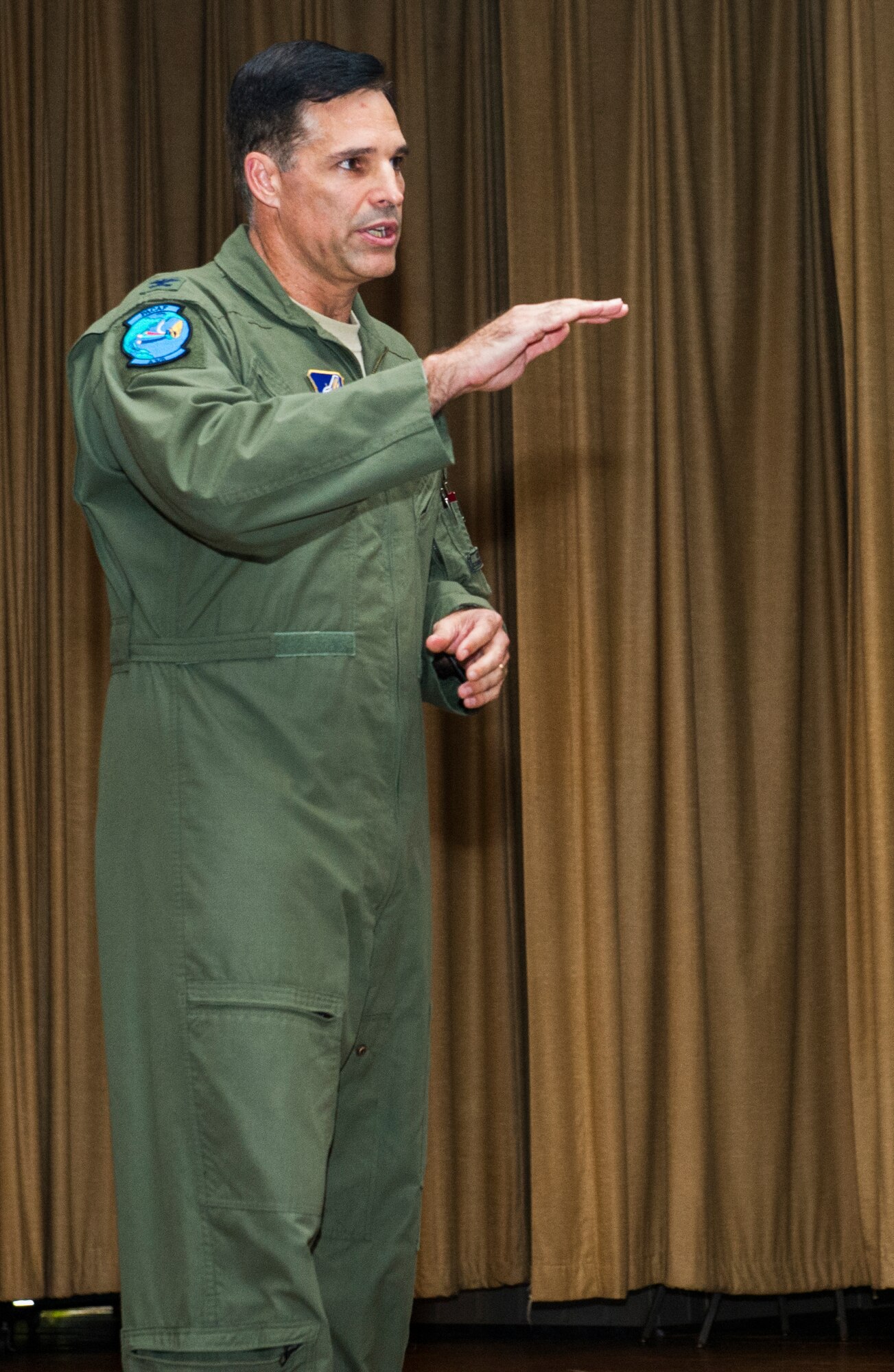 Col. John Hillyer, Pacific Air Forces  Mobility Assistant to the Director of Operations, introduces  Air Force Capt. Guy Gruters, a former prisoner of war from the Vietnam War, before Gruters’ presentation September 18, 2013 at the Hickam Base Theater, Joint Base Pearl Harbor-Hickam, Hawaii. Gruters' decorations include more than thirty combat awards, with two Silver Stars, two Distinguished Flying Crosses, two Purple Hearts, two Purple Hearts, a Bronze Star for Valor, the POW medal, a Presidential Unit Citation, and 20 Air Medals. (U.S. Air Force photo by Staff Sgt. Nathan Allen)
