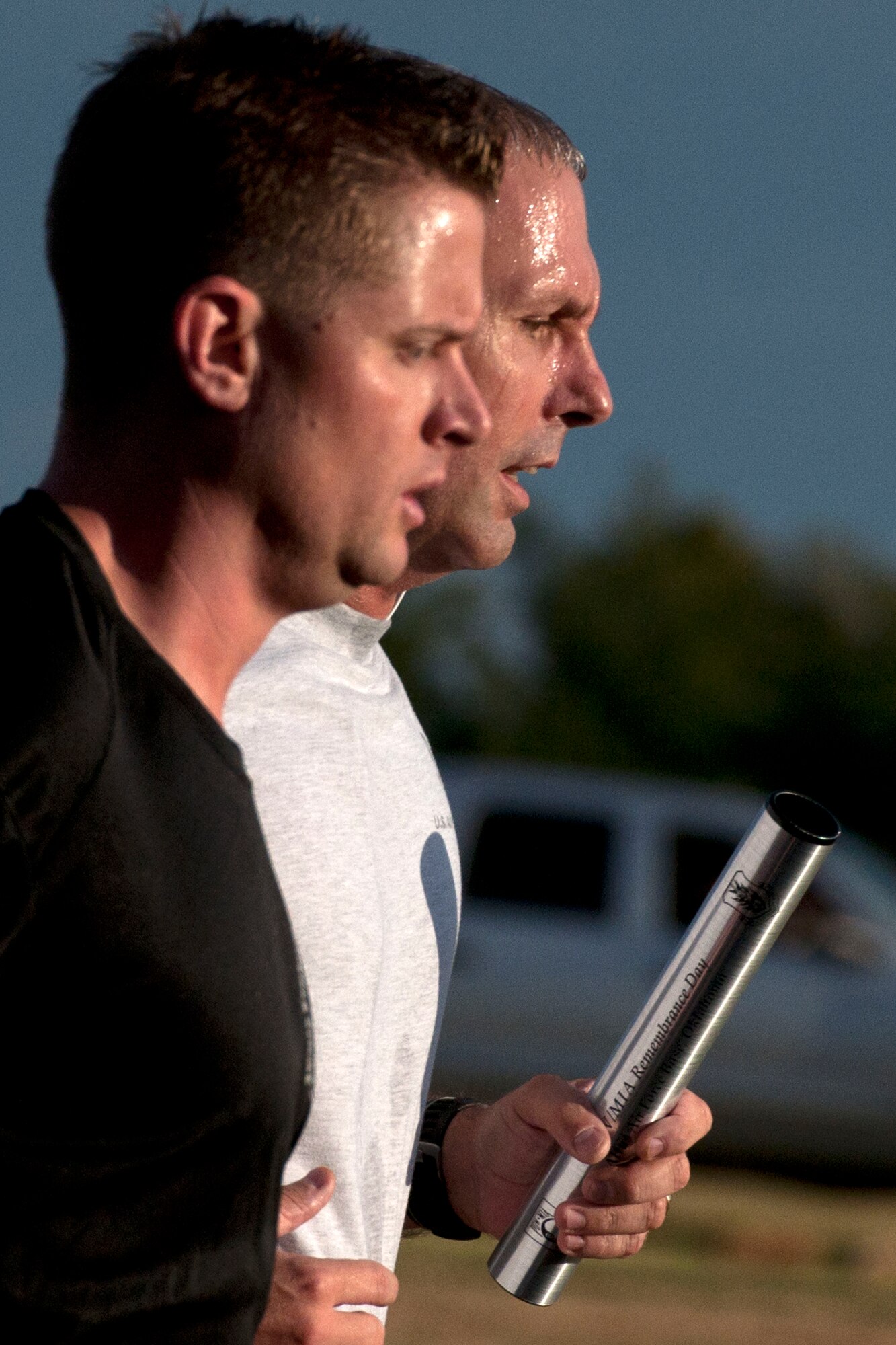 ALTUS AIR FORCE BASE, Okla. – U.S. Air Force Senior Master Sgt. Larry Mays, (right) 97th Security Forces Squadron superintendent, participates in a remembrance relay run during the third annual Prisoners of War and Missing in Action Remembrance Ceremony at the Wings of Freedom Park Sept. 19. The event consisted of a 21 gun salute, playing of “Taps”, a speech from a former POW Marine Sgt. Jack Warner and a twenty-four hour remembrance relay run. National POW/MIA Recognition Day is observed on the third Friday of September each year to remember those who were prisoners of war and those who are missing in action, as well as their families. (U.S. Air Force photo by Senior Airman Jesse Lopez/Released)