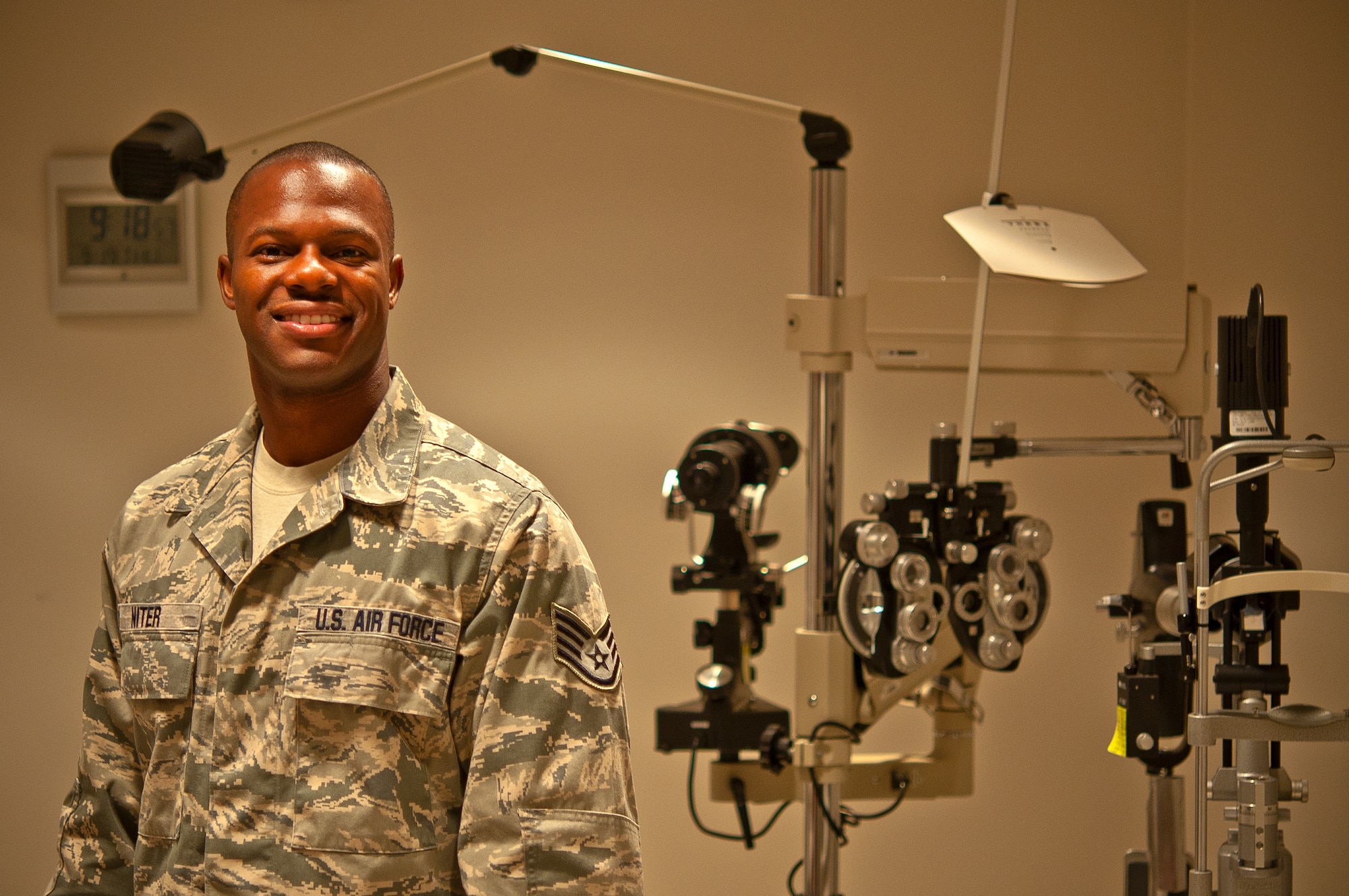 Air Force Staff Sgt. Robert Niter III, 47th Medical Operations Squadron NCO in charge of optometry, poses for a photo in the optometry clinic at Laughlin Air Force Base, Texas, Sept. 19, 2013. During a recent visit to Houston, Niter used his medical knowledge and intuition when he saw a downed pedestrian unconscious and not breathing. His quick lifesaving actions revived and kept the pedestrian alive until rescue personnel arrived on-scene. (U.S. Air Force photo/Senior Airman Scott Saldukas)