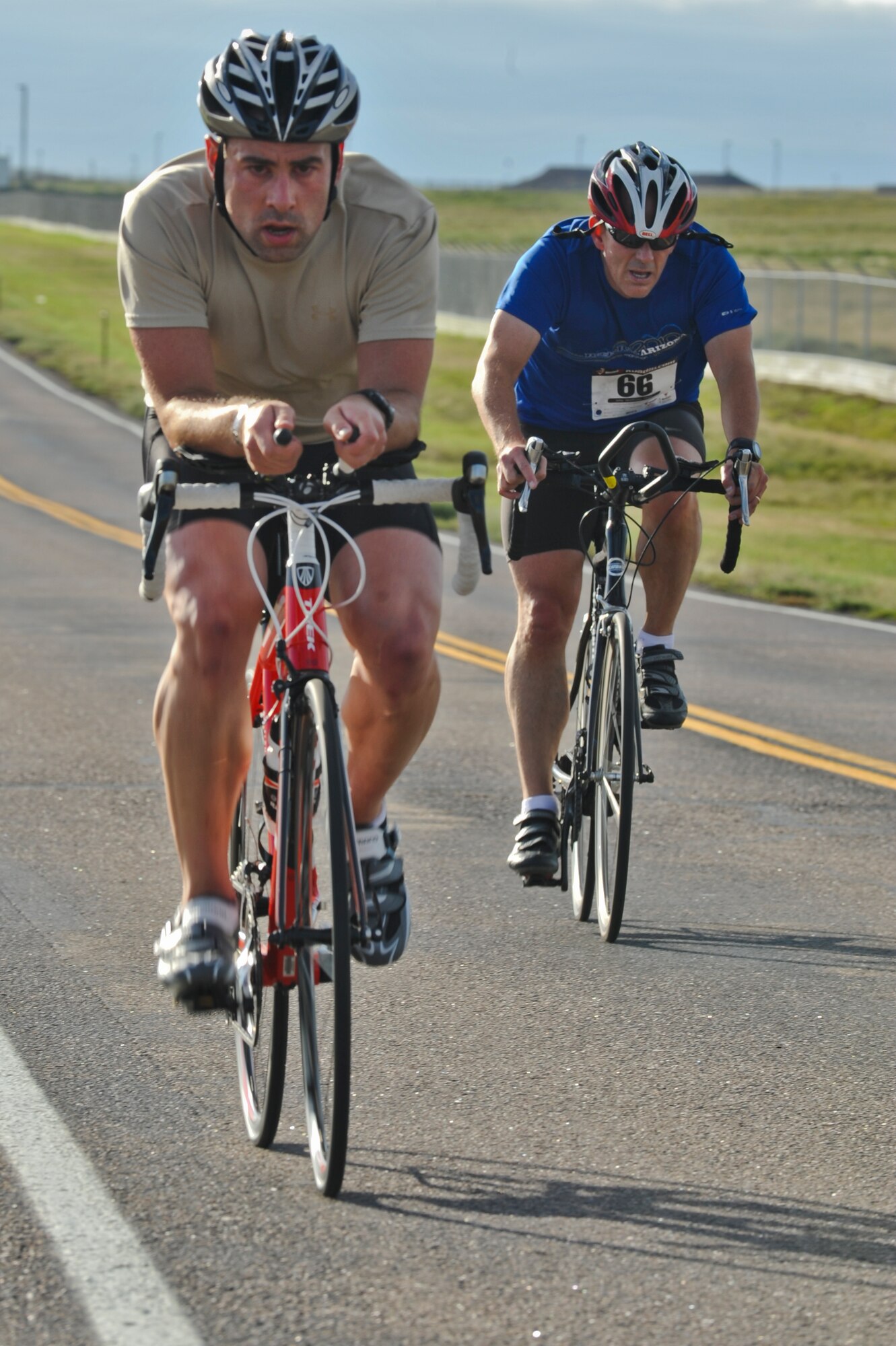John Eure pedals past an opponent during the 2nd Annual Buckley Duathlon Sept. 19, 2013, on Buckley Air Force Base, Colo. The race started with a 2-mile run, followed by a 6-mile bike ride and finished with a 1.5-mile run. (U.S. Air Force photo by Airman 1st Class Riley Johnson/Released)