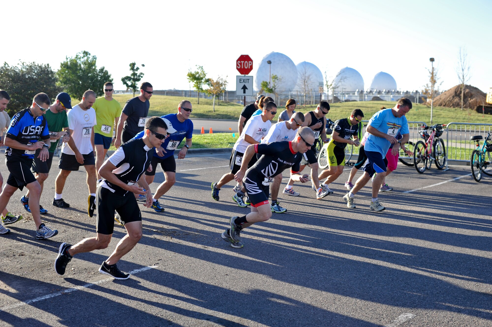 Team Buckley members begin the 2 mile portion of the 2nd Annual Buckley Duathlon Sept. 19, 2013, on Buckley Air Force Base, Colo. The race started with a 2-mile run, followed by a 6-mile bike ride and finished with a 1.5-mile run. (U.S. Air Force photo by Airman 1st Class Riley Johnson/Released)