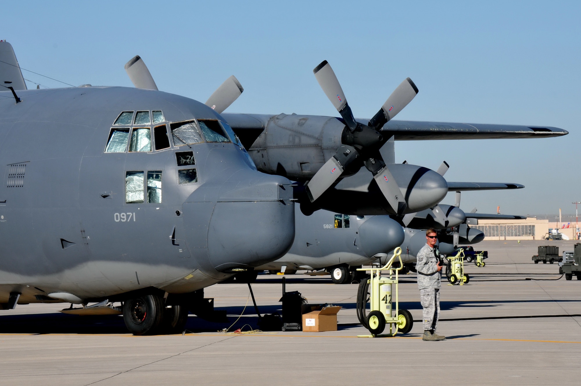 A crew member prepares for the final flight of the last of the 550th Special Operations Squadron's two assigned MC-130Ps Combat Shadows at an informal ceremony Sept. 6.  The departure of the aircraft marks the end of a 25-year training curriculum at Kirtland. (Photo by Ken Moore)