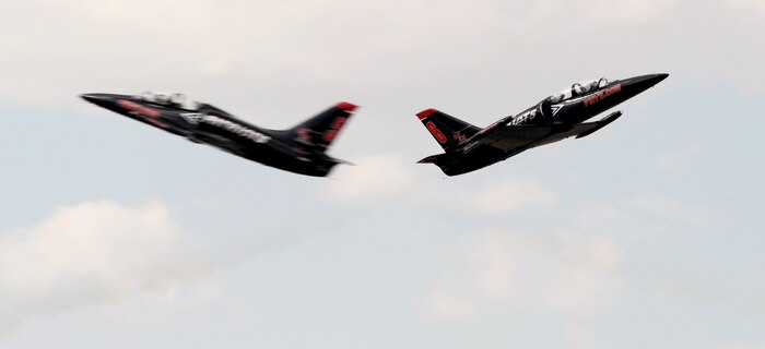 Two L-39 Albatross from the Patriots Jet Demonstration Team perform opposing high-speed passes during the National Championship Air Races at Stead Airport, Reno, Nev., Sept. 14, 2013. The Patriots are a civilian-owned jet aerobatic team. (U.S. Air Force photo by Staff Sgt. Robert M. Trujillo/Released) 