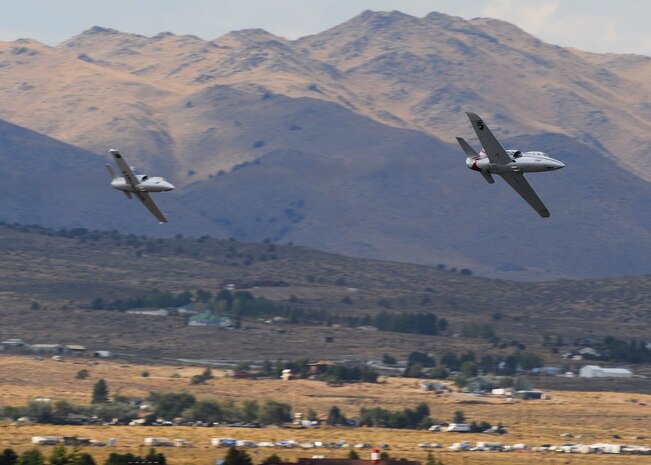 Two L-39 Albatross jet aircraft race for position during the 50th Annual National Championship Air Races at Stead Airport, Reno, Nev., Sept. 14, 2013. These aircraft often reach speeds close to 500 mph. (U.S. Air Force photo by Staff Sgt. Robert M. Trujillo/Released)