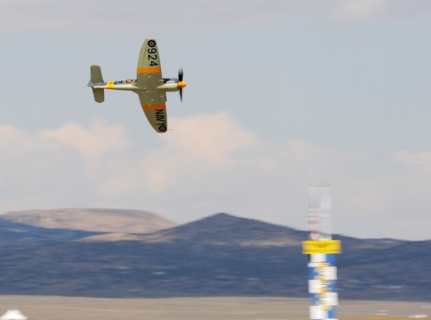 A vintage fighter aircraft races for position during the 50th Annual National Championship Air Races at Stead Airport, Reno, Nev., Sept. 14, 2013. Aircraft often reach speeds of more than 400 mph. (U.S. Air Force photo by Staff Sgt. Robert M. Trujillo/Released)