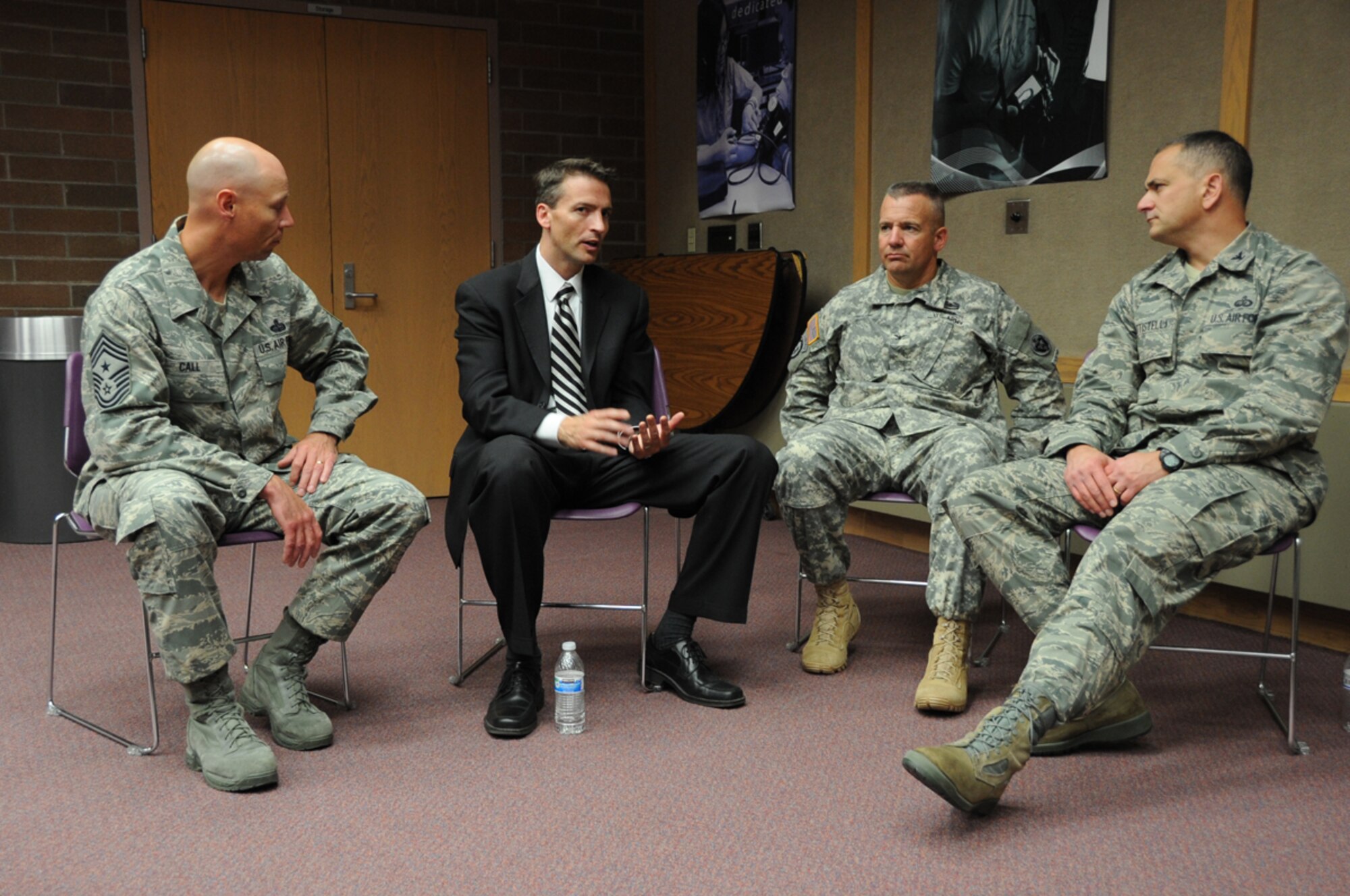 Ed Graff, Anchorage School District superintendent, discusses events for the School Partnership Program with JBER leadership at the King Career Center of Anchorage, September 12.  The School Partnership Program is a program to help motivate and tutor students. (U.S. Air Force Photo/Airman 1st Class Omari Bernard)