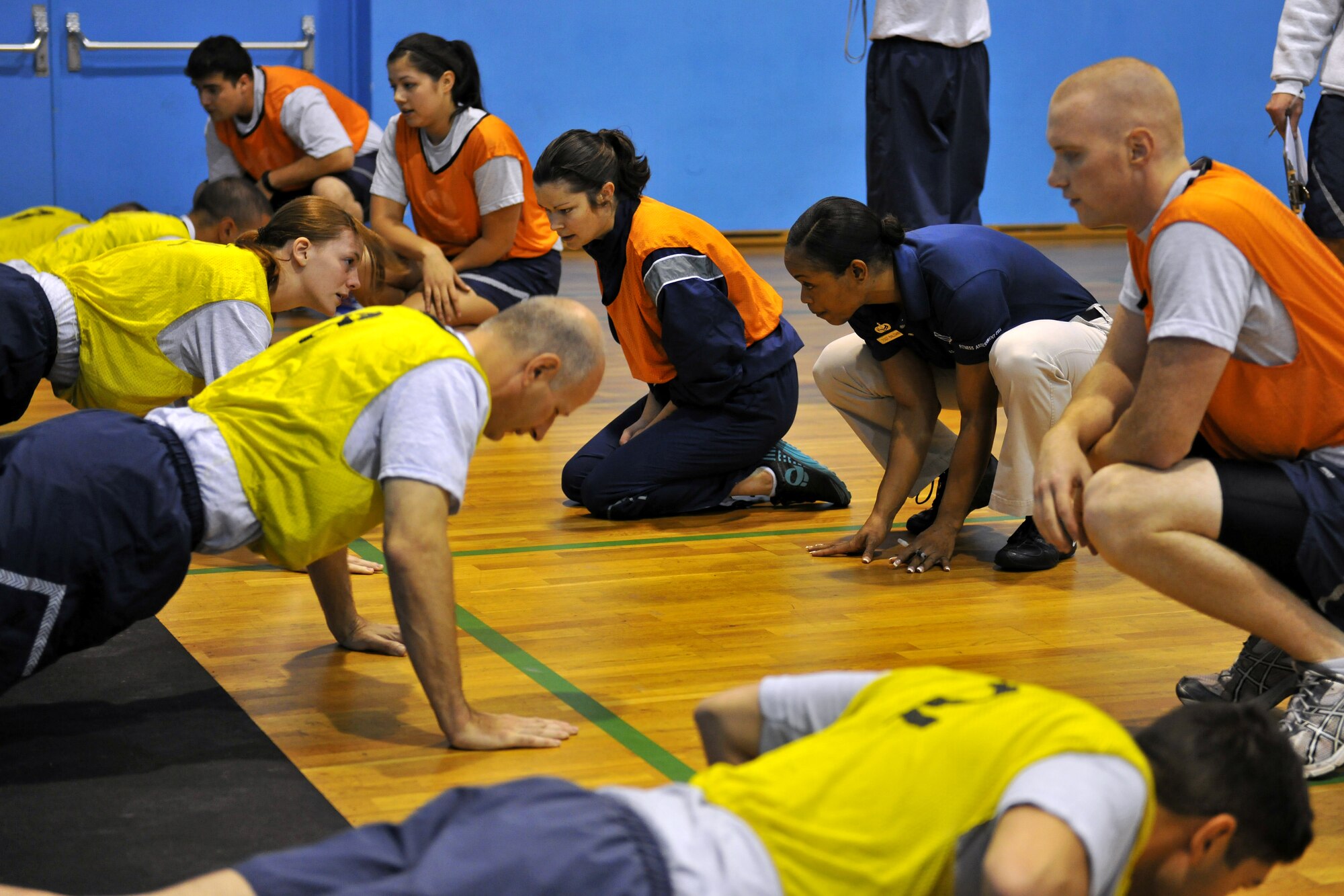 Tech. Sgt. Heather Baldwin (wearing the blue shirt), 786th Force Support Squadron NCOIC fitness assessment cell, tests Air Force members on their fitness, Sept. 15, 2013, Ramstein Air Base, Germany.  Baldwin uses her background as a body building competitor to help motivate others to make fitness a way of life.  (U.S. Air Force photo/Senior Airman Chris Willis)