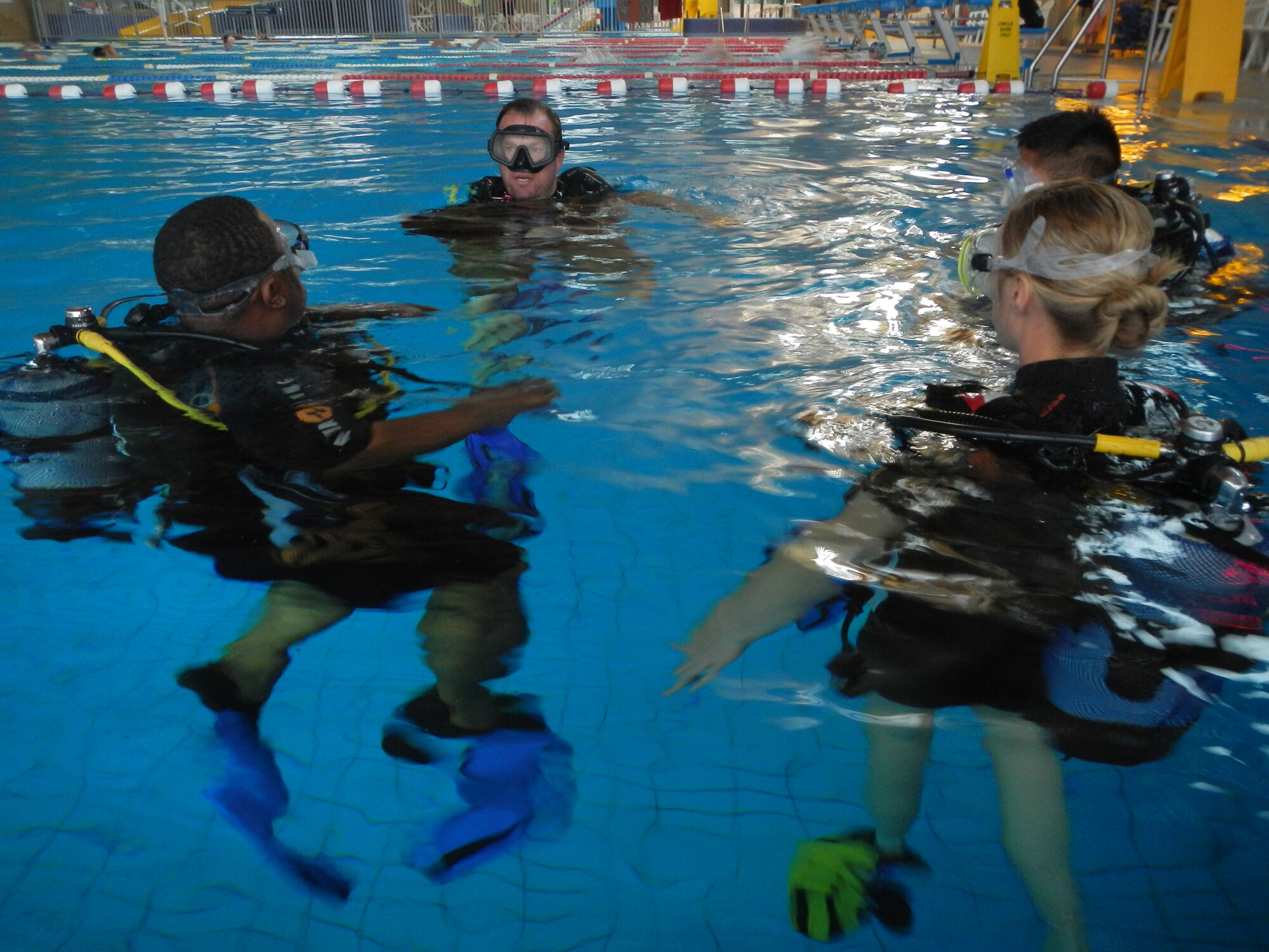 Easy Dive instructor Mike Johnson (center) instructs students on proper scuba diving techniques, Sept. 11, 2013, Ramstein Air Base, Germany. (U.S. Air Force photo/Senior Airman Caitlin Guinazu)
