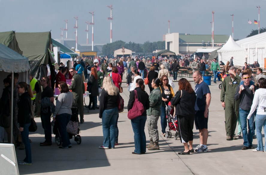 Ramstein Welfare Bazaar patrons wait in line to order food from the outdoor food vendors, Sept. 13, 2013, Ramstein Air Base, Germany. The food court was entirely manned by Airmen and family volunteers from private organizations. (U.S. Air Force photo/Senior Airman Jose L. Leon)