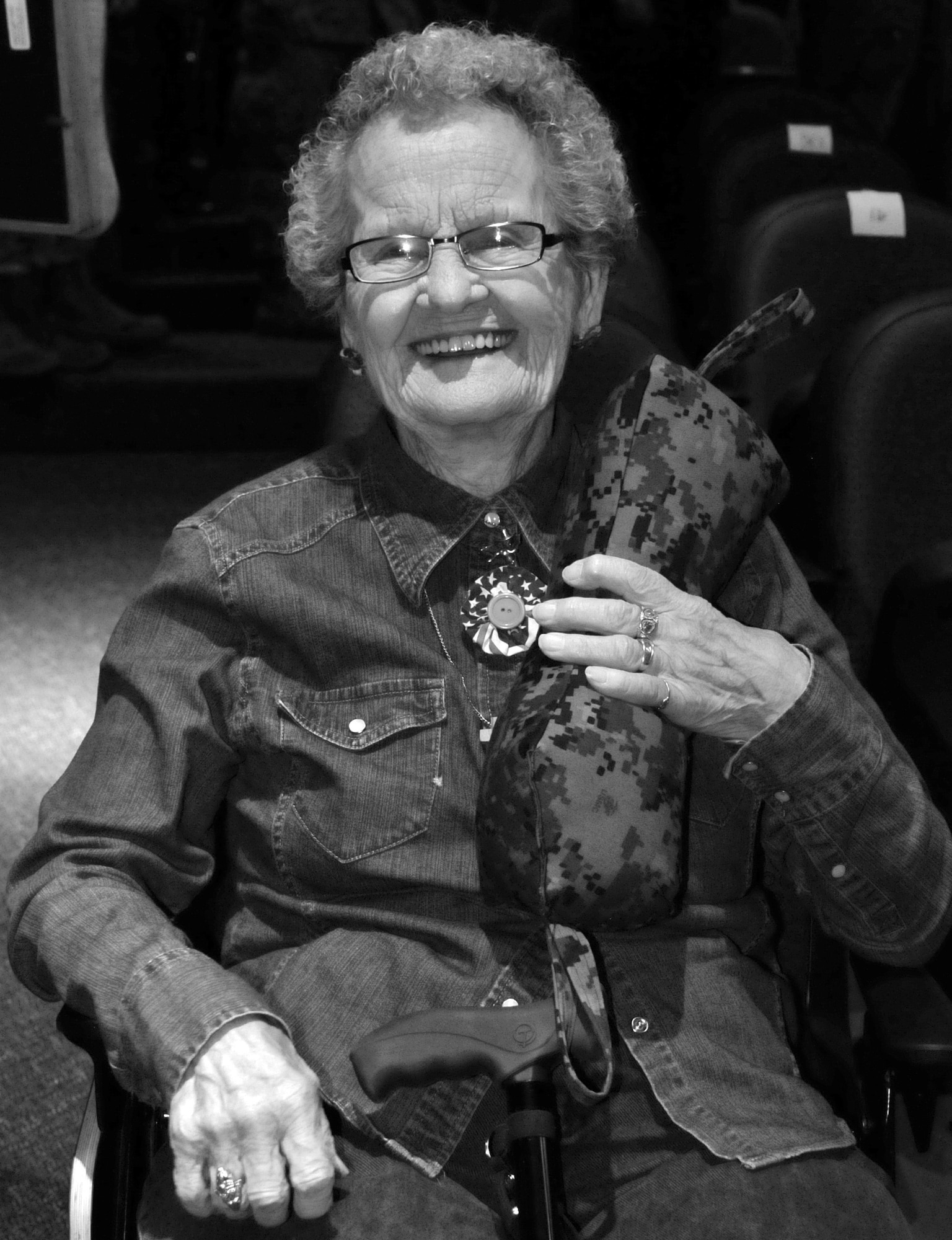 Berniece Farris poses with one of her “comfort pillows” at Central High School, Cheyenne, Wyo., during the 153rd Airlift Wing’s change of command ceremony, where she was honored for her lifetime of service to the men and women of the armed forces, Aug. 3, 2013. For almost half a century, Farris has lovingly fashioned approximately 9,000 pillows for American veterans of wars spanning an entire century. (U.S. Air National Guard photo by Tech. Sgt. Natalie Stanley)