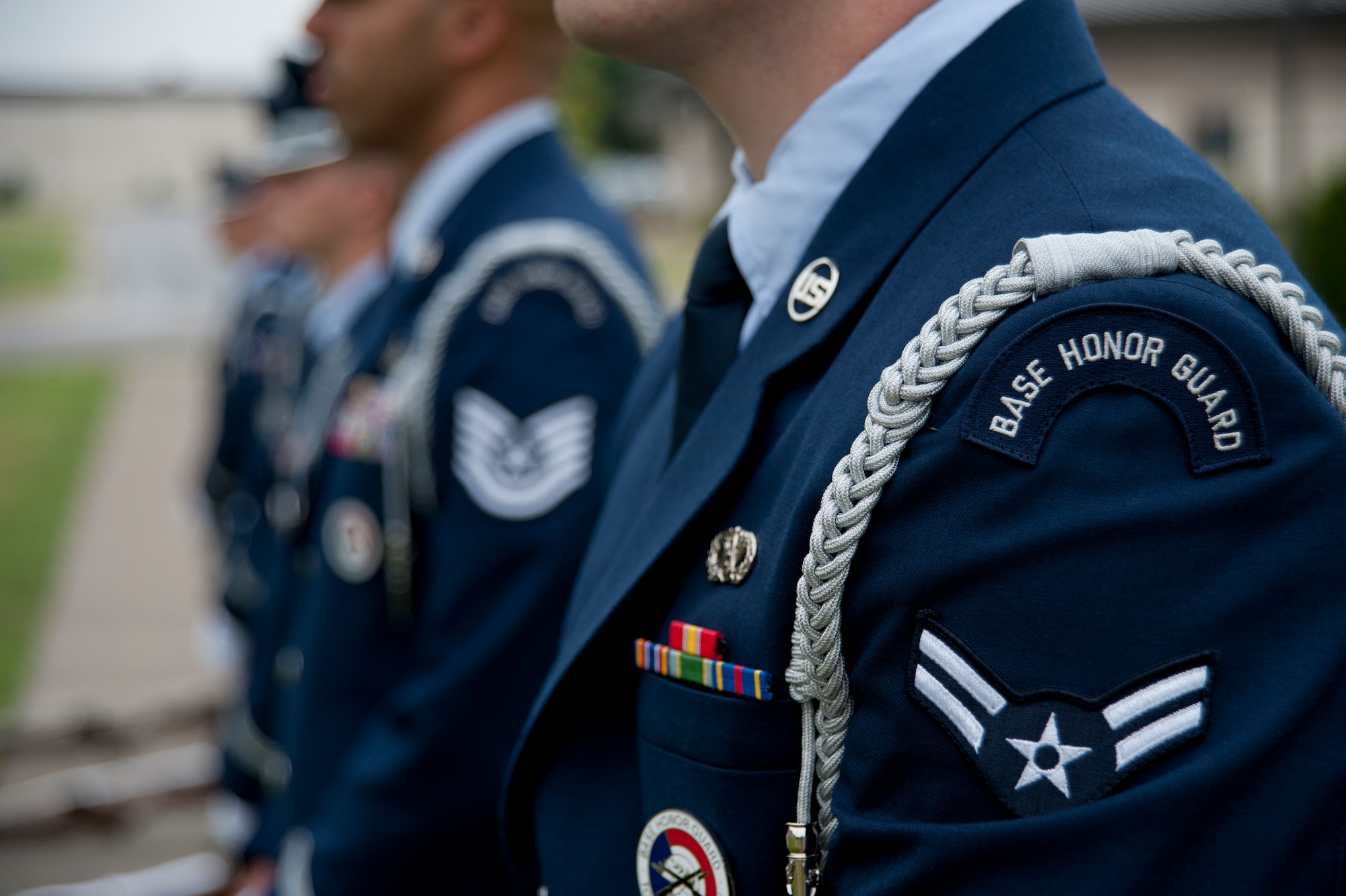 An airman first class from the 22nd Air Refueling Wing Honor Guard stands at parade rest alongside his NCO in charge Sept. 16, 2013, at McConnell Air Force Base, Kan. The base honor guard’s mission is to represent Airmen to the American public and ensure the legacy of Airmen who promote the mission, protect the standards, perfect the image and preserve Air Force heritage. (U.S. Air Force photo/Airman 1st Class Victor J. Caputo)