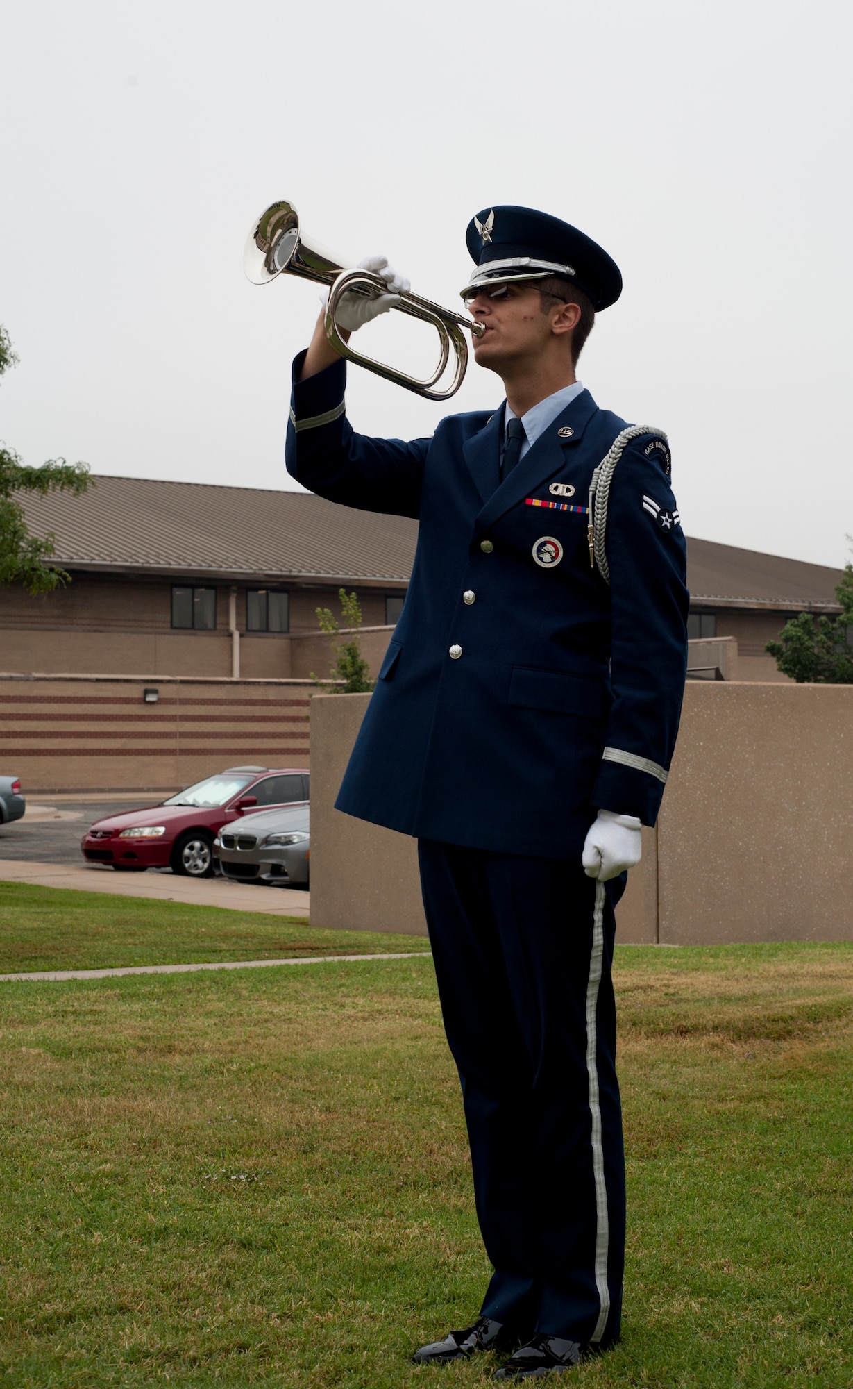Airman 1st Class Nicholas Luciano, 22nd Air Refueling Wing Honor Guard guardsman, plays taps at the end of a memorial service Sept. 16, 2013, at McConnell Air Force Base, Kan. The traditional military song marked the end of a memorial held for deceased service members. (U.S. Air Force photo/Airman 1st Class Victor J. Caputo)