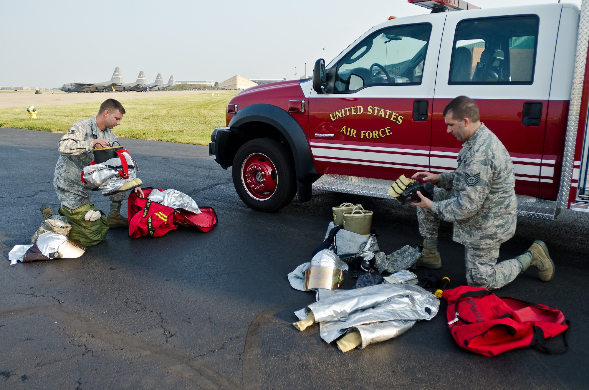 Staff Sgt. Kyle Miller (left) and Tech. Sgt. Dewayne Gibson, fire protection craftsmen from the 123rd Civil Engineer Squadron, inspect firefighting equipment Sept. 10, 2013, at the Kentucky Air National Guard Base in Louisville, Ky., prior to an overseas deployment. More than 85 Kentucky Air Guardsmen are being mobilized to support Air Expeditionary Force rotations and other Air Force missions this summer and fall. (U.S. Air National Guard photo by Master Sgt. Phil Speck)